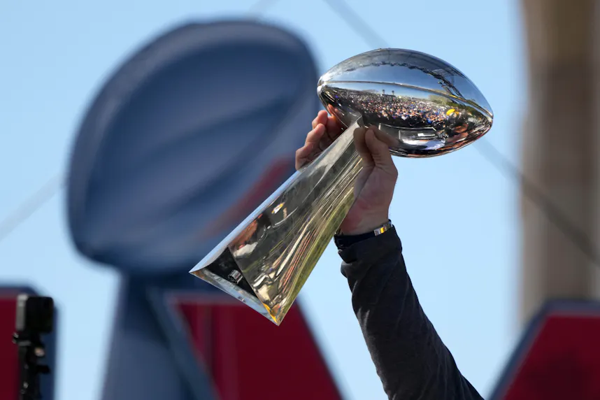 Los Angeles Rams tackle Andrew Whitworth holds the Vince Lombardi trophy as we examine our ChatGPT AI simulation of the NFL all-time bracket to determine who is the greatest NFL team of all time.