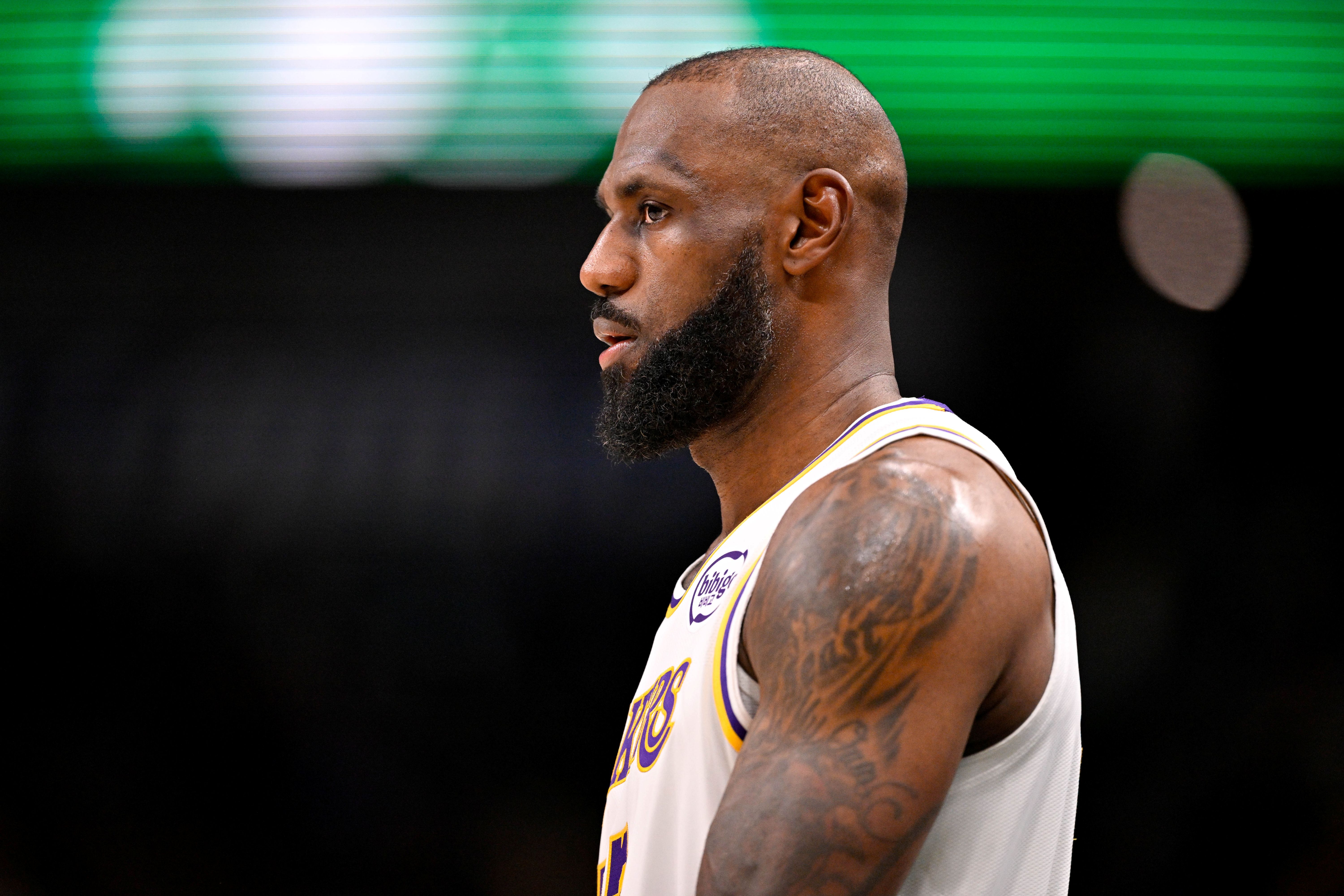 Los Angeles Lakers forward LeBron James (23), seen here looking on during a game, is featured in our Lakers vs. Thunder player props for Game 1 tonight.