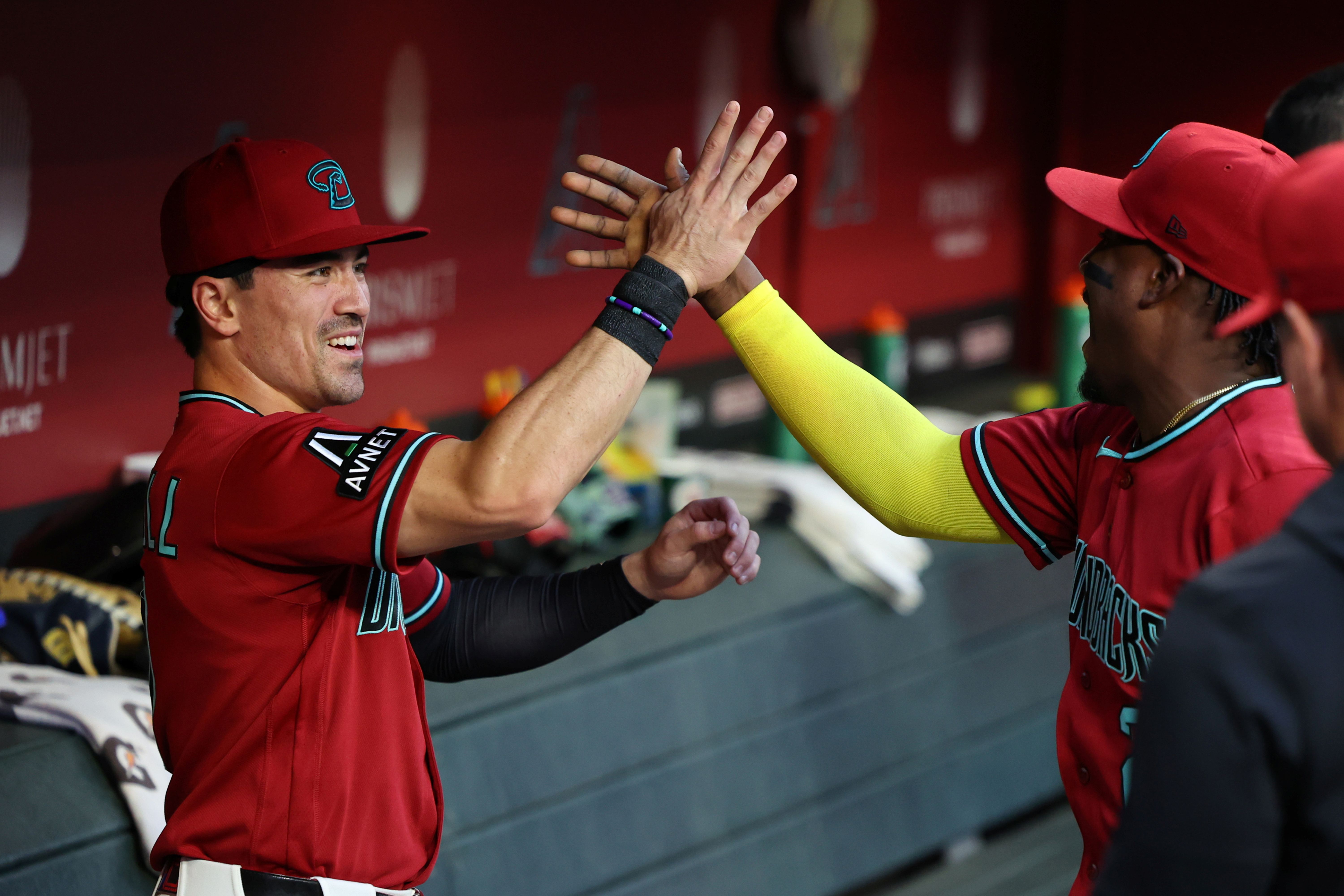 Arizona Diamondbacks right fielder Corbin Carroll reacts with shortstop Geraldo Perdomo in the dugout, and he's featured in my Diamondbacks vs. Padres prediction.
