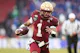 Thomas Castellanos of the Boston College Eagles rushes against the Southern Methodist Mustangs as we look at Fanatics Sportsbooks fine for violating college football betting laws in Massachusetts.