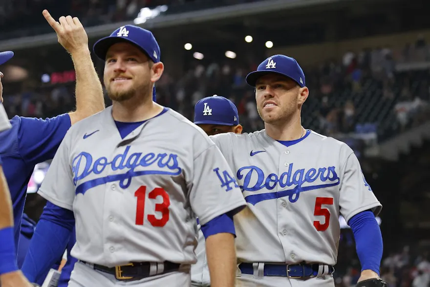 Max Muncy and Freddie Freeman of the Los Angeles Dodgers celebrate after a 5-3 victory over the Atlanta Braves, and we offer our top Dodgers vs. Padres player props based on the best MLB odds.