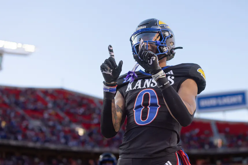 Kansas Jayhawks wide receiver Quentin Skinner celebrates after scoring a touchdown against the Iowa State Cyclones, and we offer our college football upset picks for Week 12.
