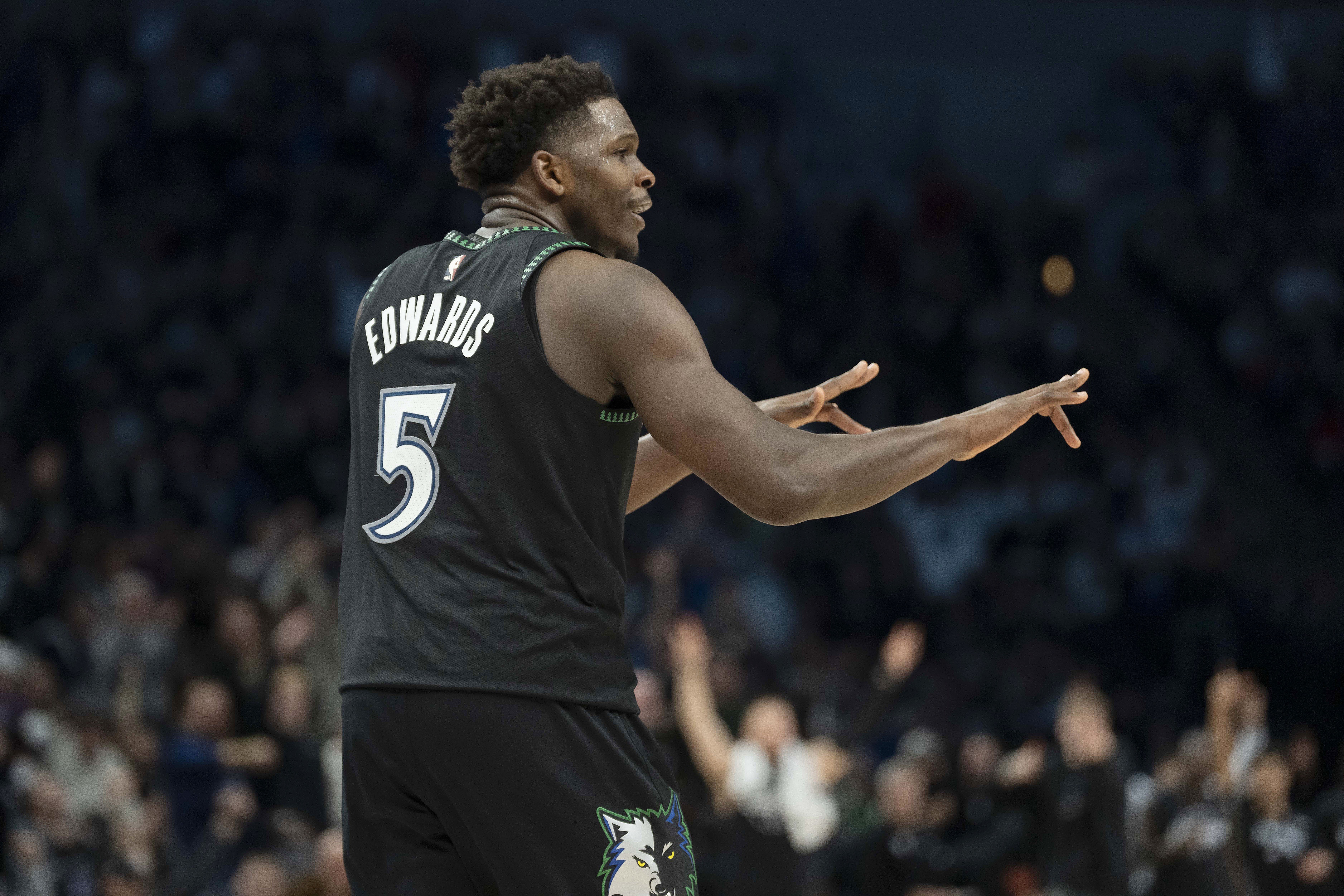 Minnesota Timberwolves guard Anthony Edwards (5) celebrates as he is featured in our Timberwolves vs. Nuggets player props.