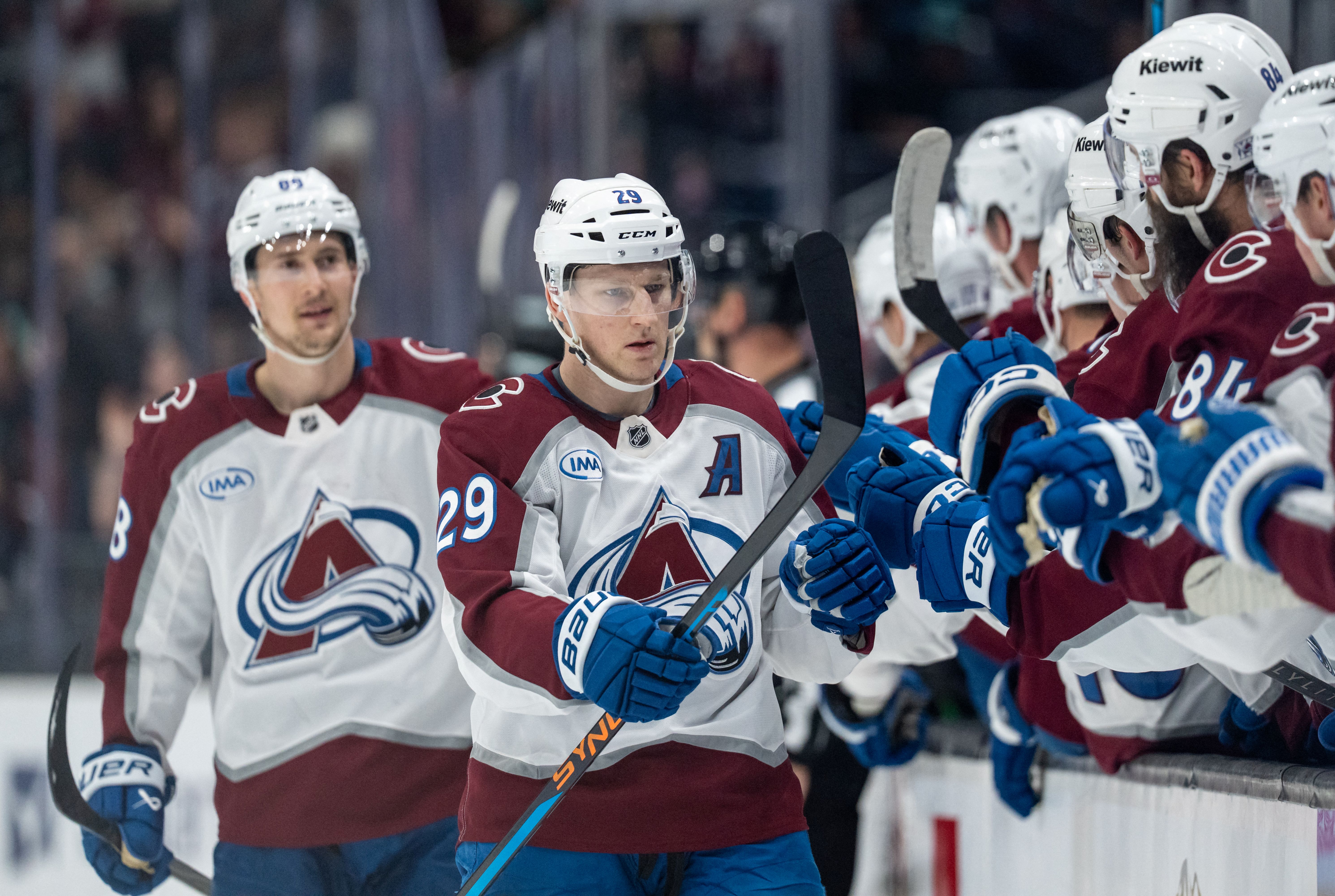 Colorado Avalanche forward Nathan MacKinnon (29), seen here celebrating during a game, is featured in our Golden Knights vs. Avalanche prediction and odds for Game 1 tonight.