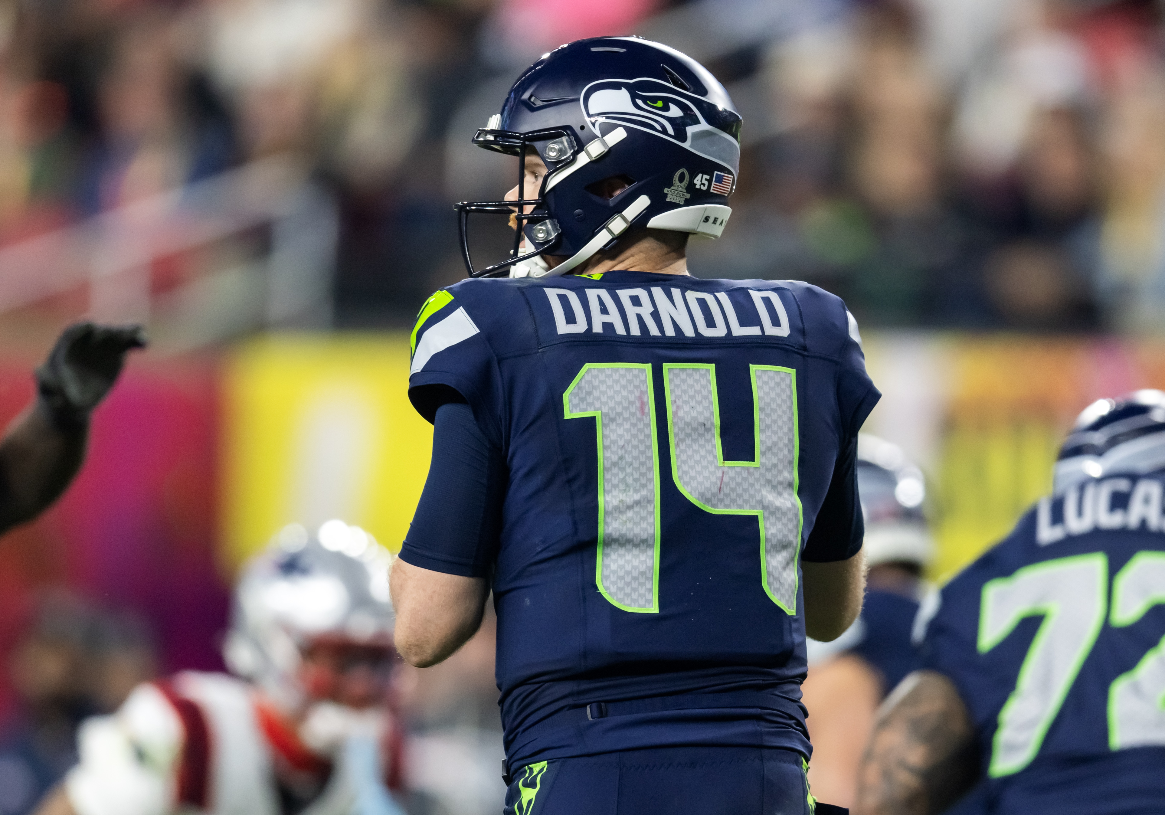 Seattle Seahawks quarterback Sam Darnold sets to pass as we make our Patriots vs. Seahawks expert picks