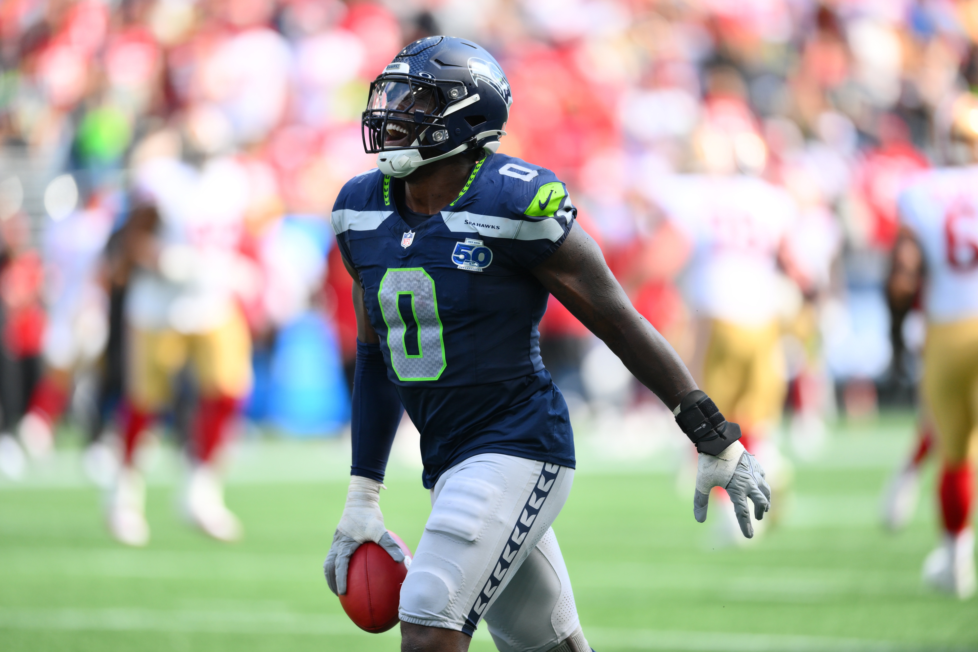 DeMarcus Lawrence reacts after a play as we offer our Rams vs. Seahawks prediction.