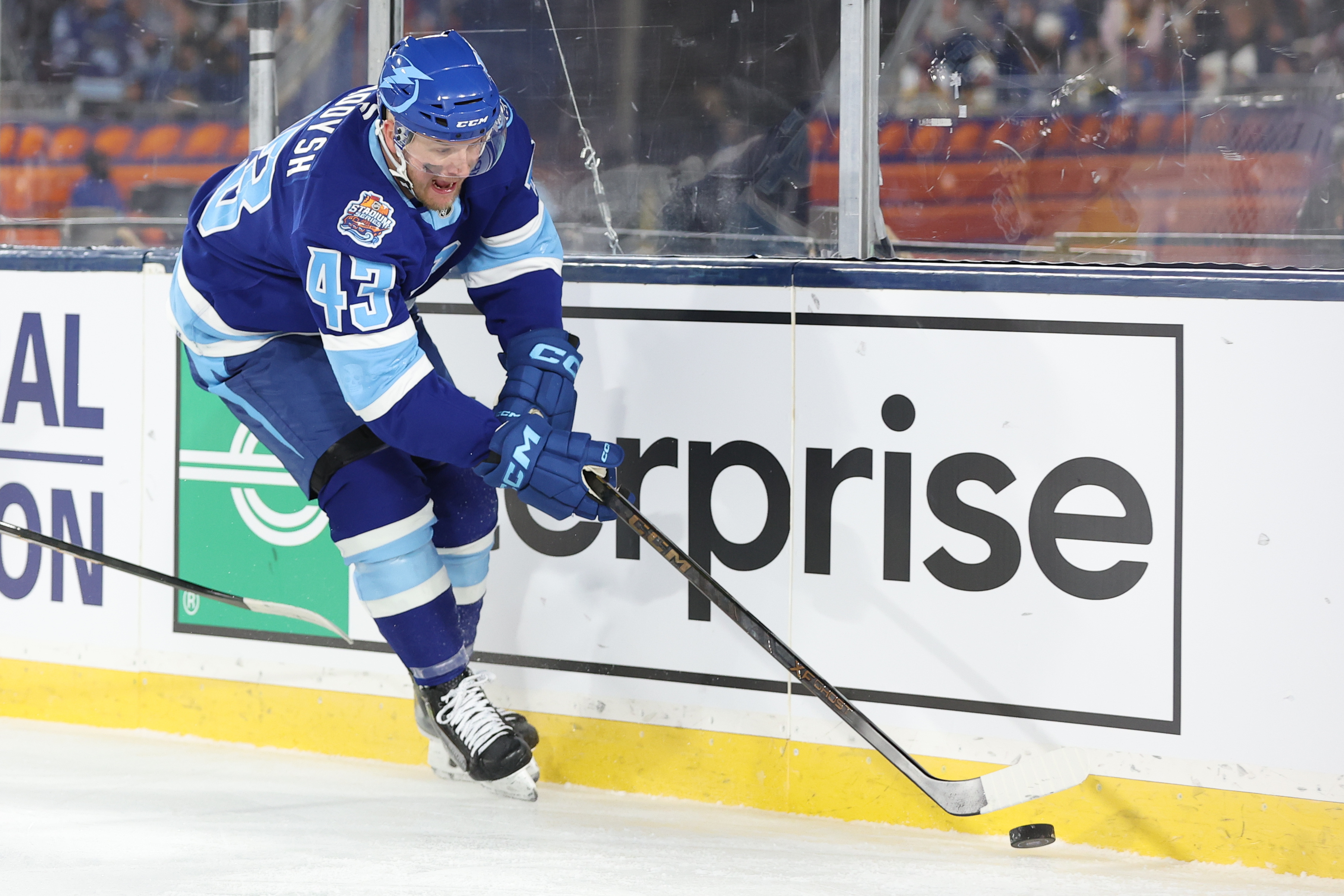 Tampa Bay Lightning defenseman Darren Raddysh (43), who is featured in our Lightning vs. Wild prediction, reaches for the puck.