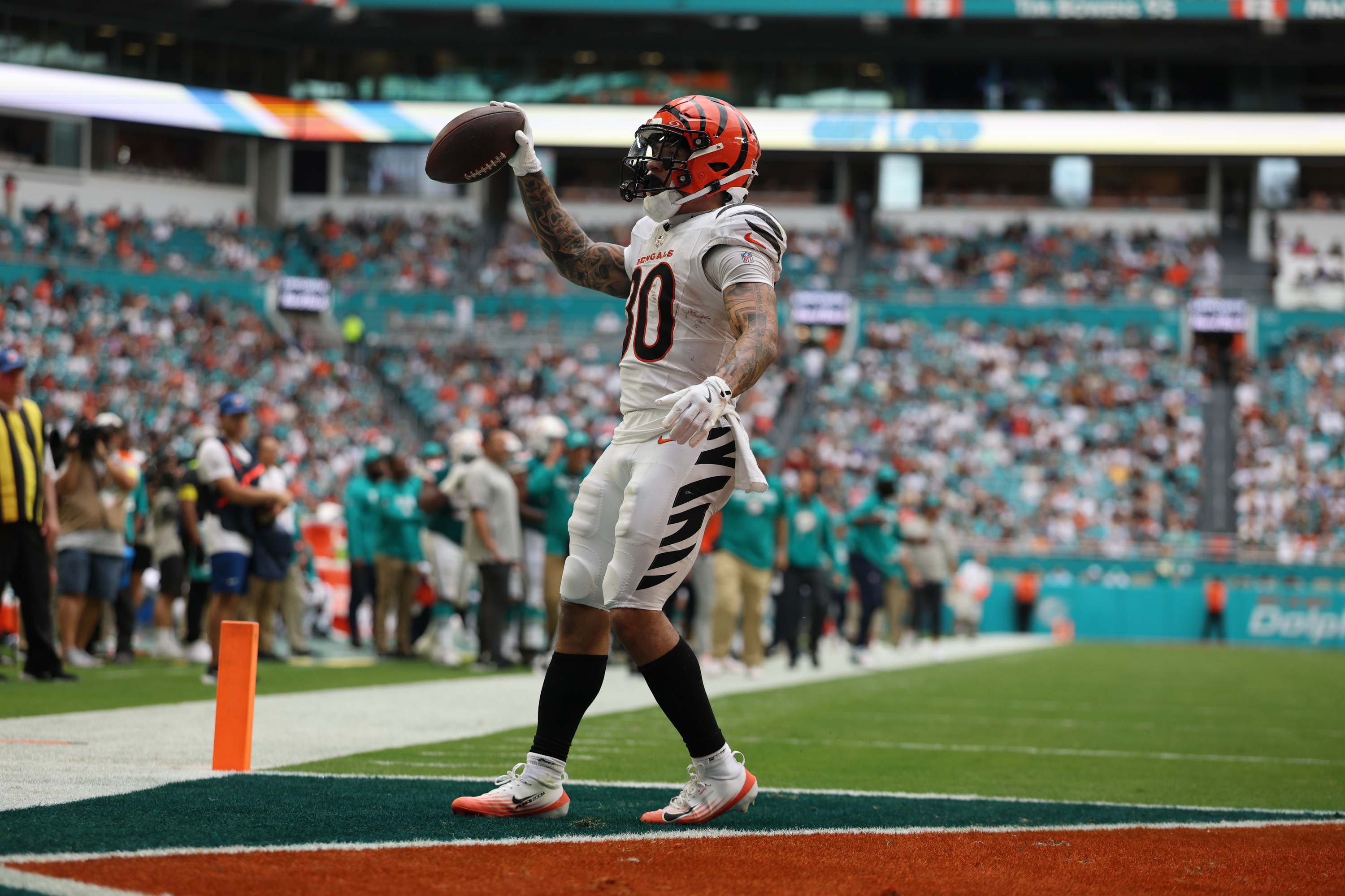 Cincinnati Bengals running back Chase Brown (30) scores a touchdown as he is featured in our NFL 2+ touchdown scorer predictions.