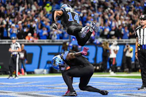 Jahmyr Gibbs celebrates a touchdown with wide receiver Amon-Ra St. Brown, with the Detroit Lions featured in my NFL Picks Against the Spread Week 9