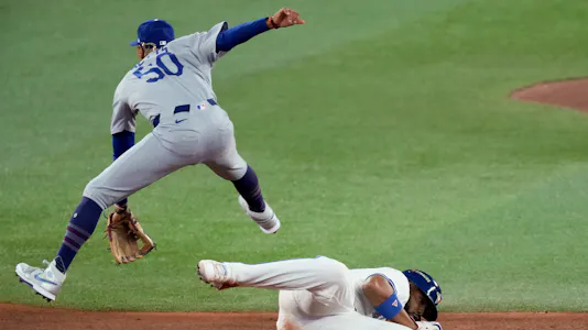 Toronto Blue Jays' Vladimir Guerrero Jr. is out as Los Angeles Dodgers' Mookie Betts turns a double play, and we make our best Blue Jays vs. Dodgers Game 3 player prop bets