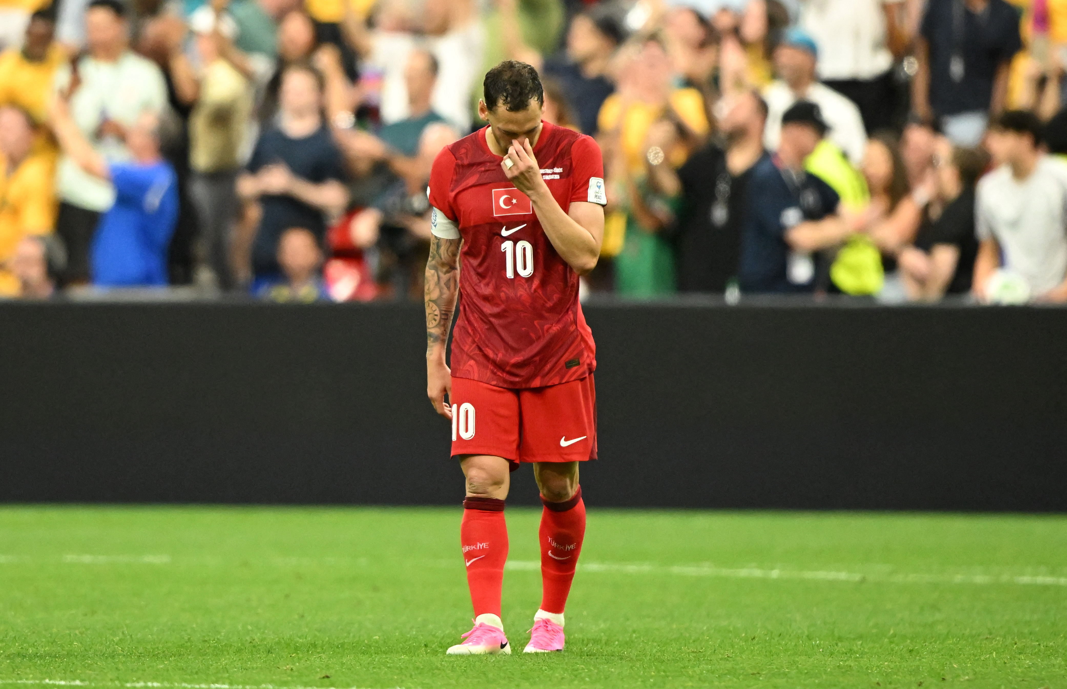Turkey's Hakan Calhanoglu reacts as he is featured in our Turkey vs Paraguay prediction.