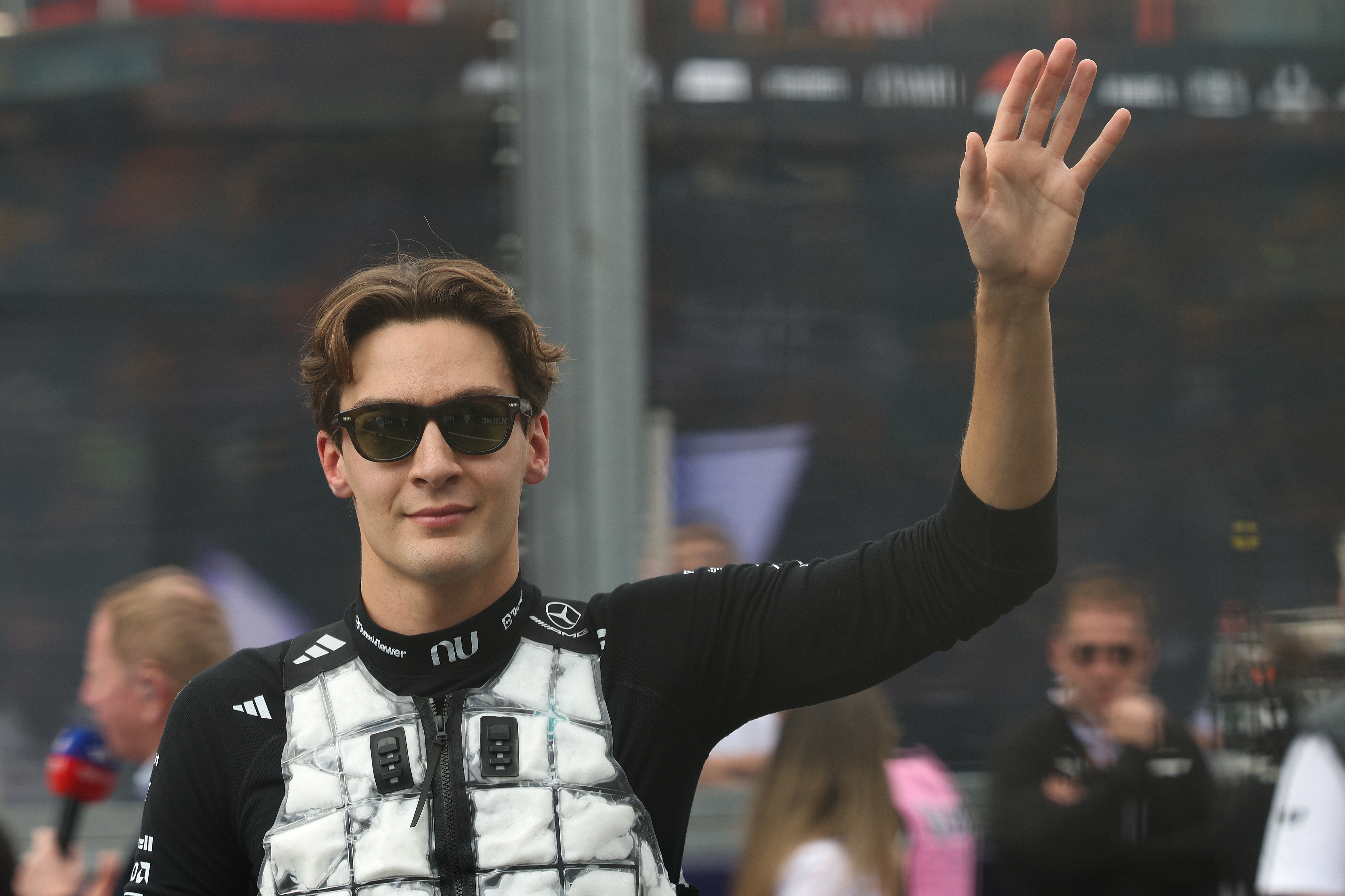 George Russell waving to the crowd as we offer our Chinese Grand Prix expert picks and odds. 