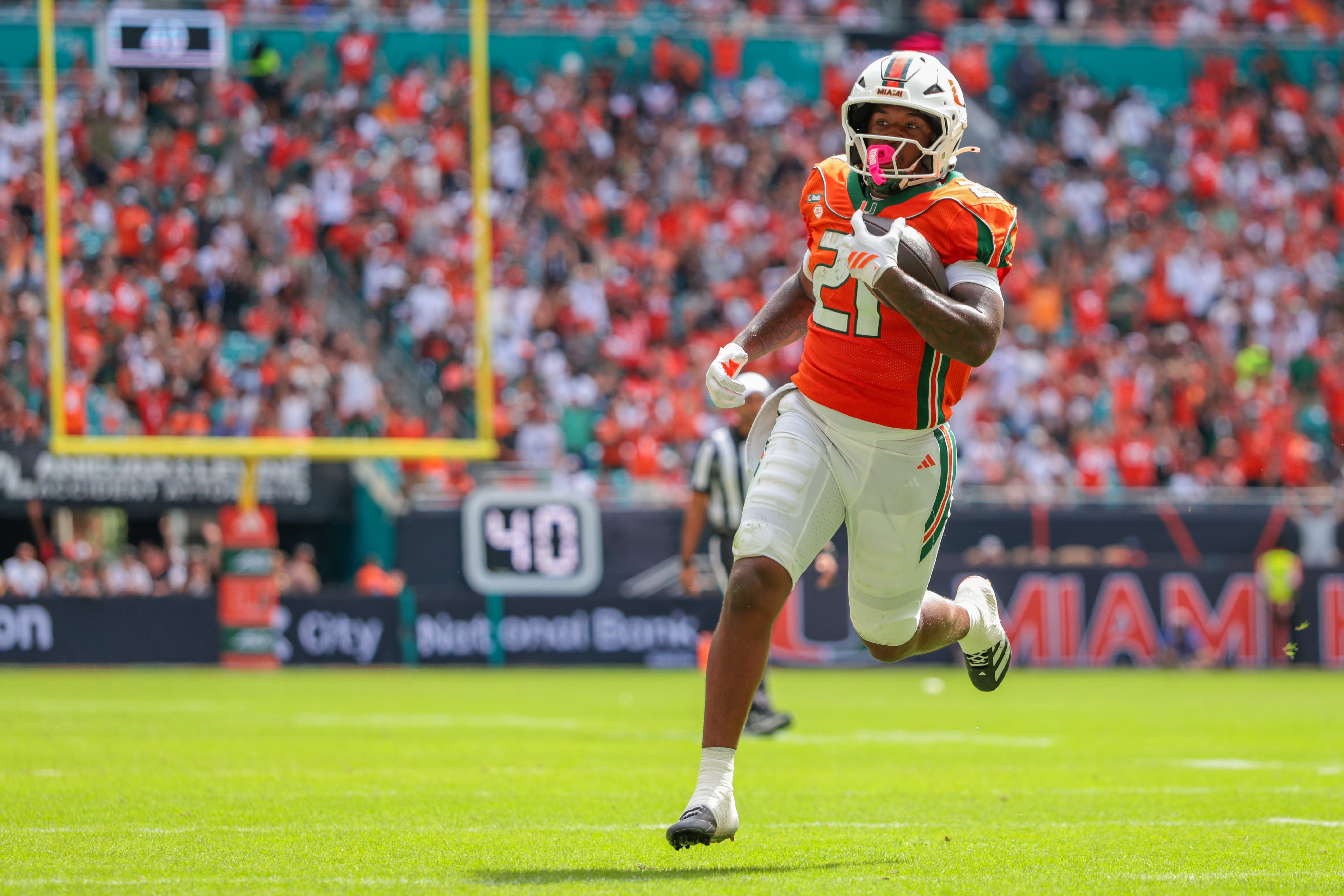 Miami Hurricanes running back Javian Mallory runs as we make our best college football player prop bets for Week 9.