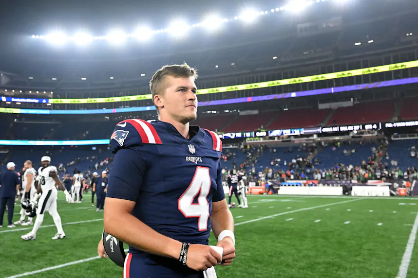 New England Patriots quarterback Bailey Zappe walks off of the field as we look at Massachusetts' sports betting financials for July 2024