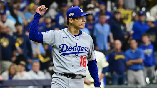 Los Angeles Dodgers pitcher Yoshinobu Yamamoto (18) reacts after a game as we look at our Dodgers vs. Blue Jays player prop bets for Game 2