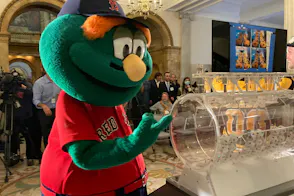 Red Sox mascot Wally the Green Monster attends a special November daily Lottery number drawing as we look at the Massachusetts 2024 FY financials.
