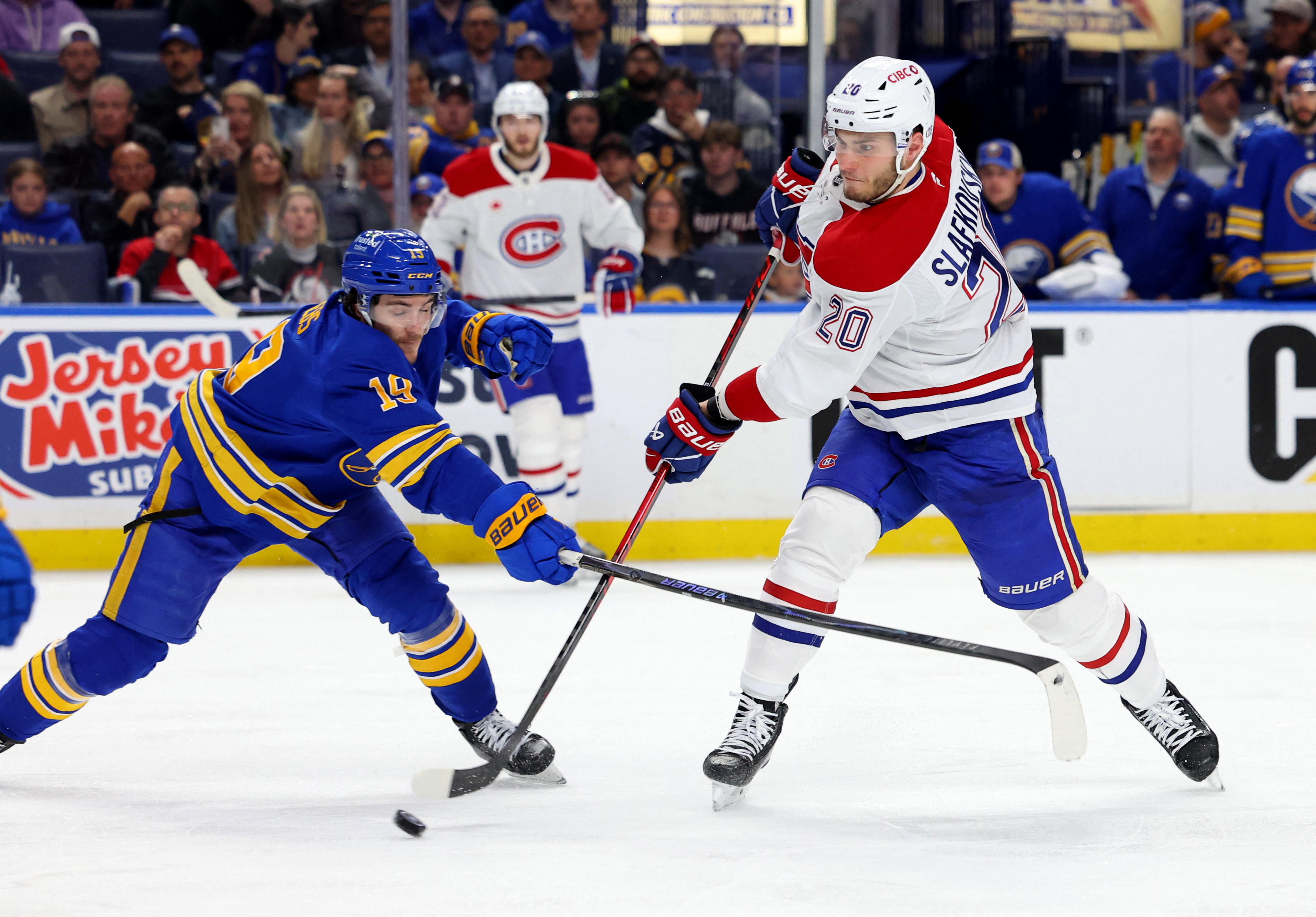Buffalo Sabres center Peyton Krebs (19) tries to block a shot by Montreal Canadiens left wing Juraj Slafkovsky (20) as we offer our Sabres vs. Canadiens prediction for Game 6.