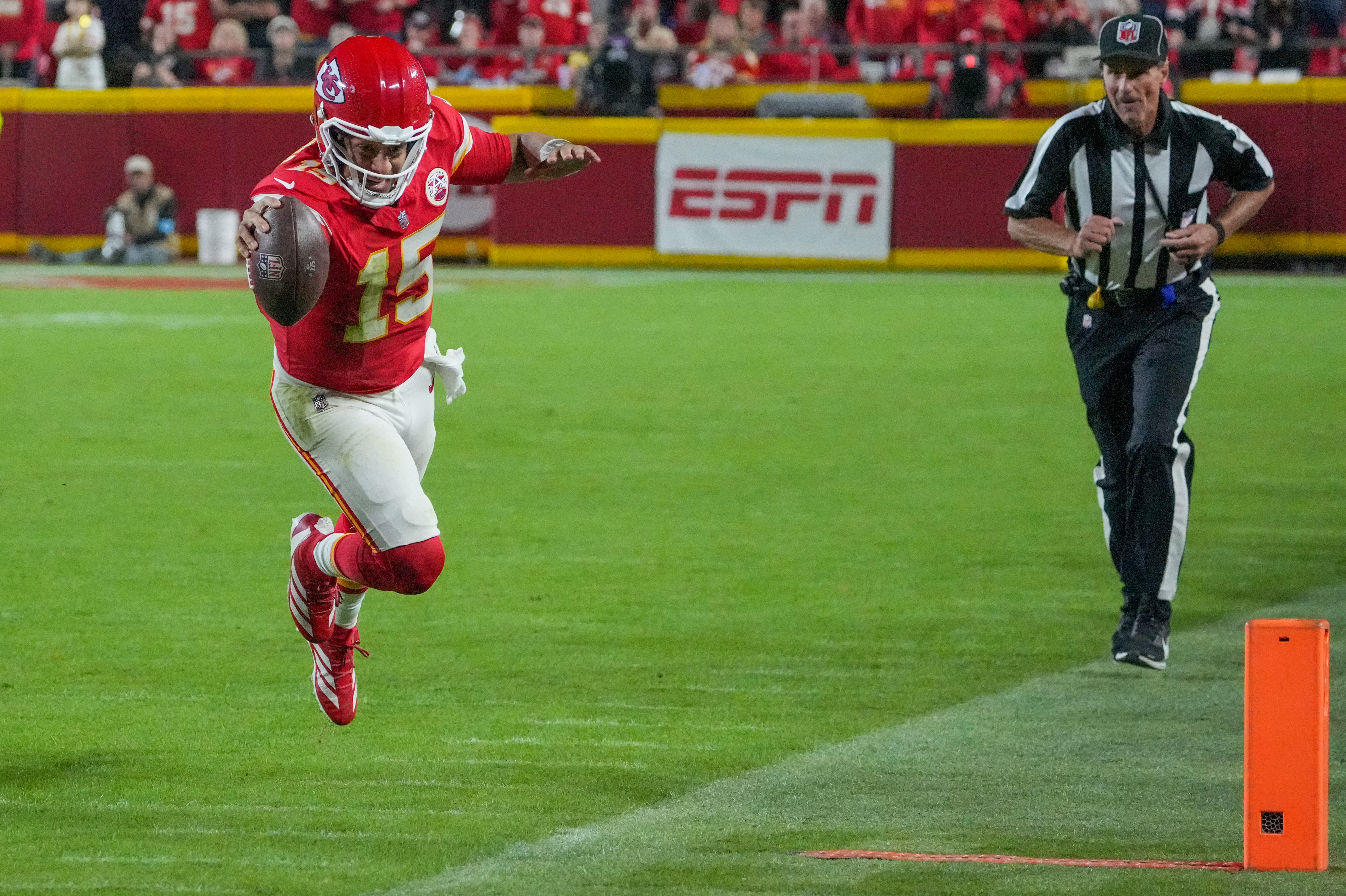 Kansas City Chiefs quarterback Patrick Mahomes runs the ball and dives for a first down against the New Orleans Saints as we offer our Patrick Mahomes player props for the Chiefs vs. 49ers. 