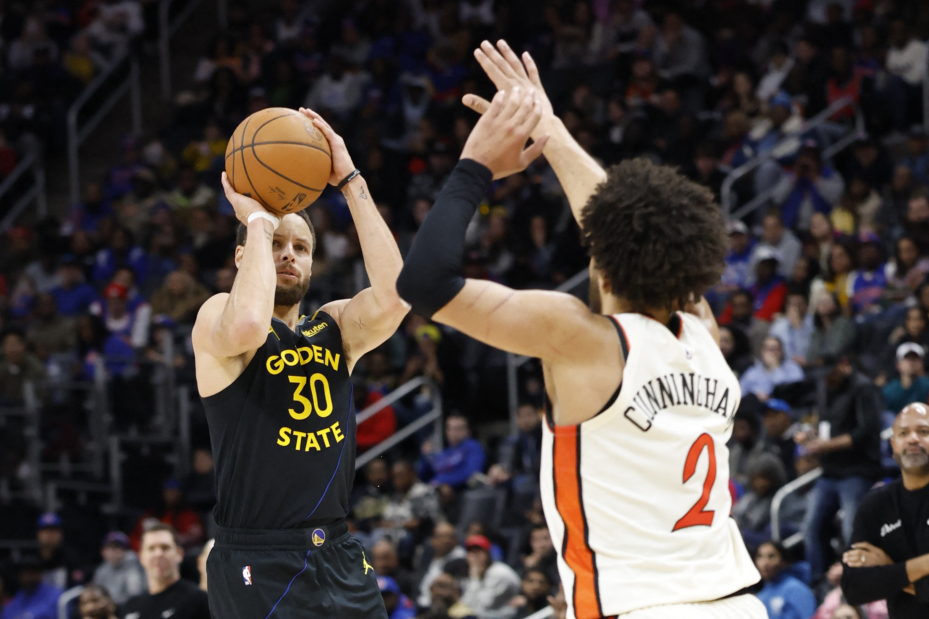Golden State Warriors guard Stephen Curry (30) shoots against Detroit Pistons guard Cade Cunningham (2), and both are featured in our Pistons vs. Warriors player props.