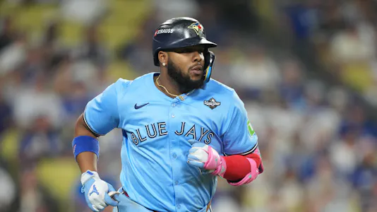 Toronto Blue Jays first baseman Vladimir Guerrero Jr. (27) - who is the focus of our Vladimir Guerrero Jr. player prop bets for World Series Game 5 - runs after hitting a single against the Los Angeles Dodgers.