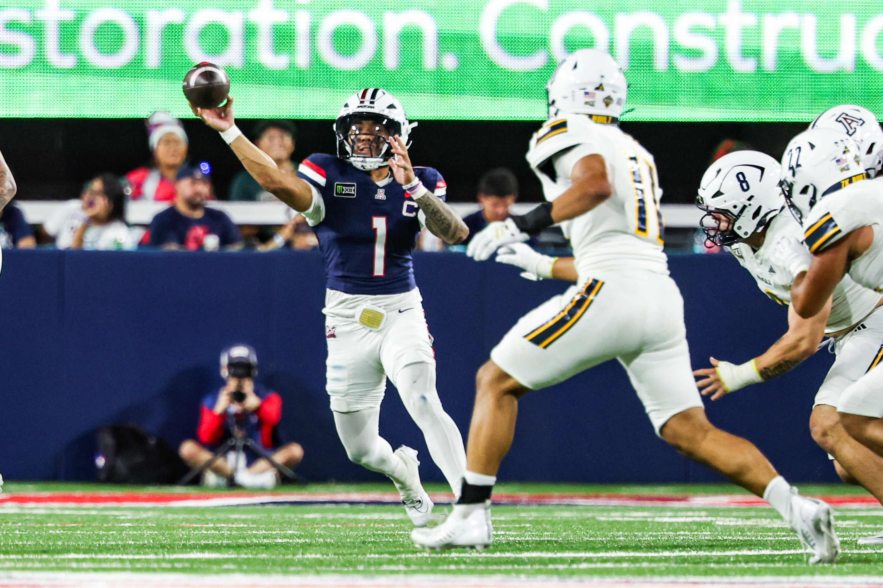 Pictured: Wildcats quarterback Noah Fifita throwing a pass as we break down our Arizona vs. Washington State Prediction. Photo by Aryanna Frank-Imagn Images.