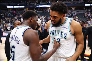 Karl-Anthony Towns (32) and Anthony Edwards (5) of the Minnesota Timberwolves react after winning Game 7 against the Denver Nuggets, as we offer our best Mavericks vs. Timberwolves player props for Game 1 at Target Center on Wednesday.