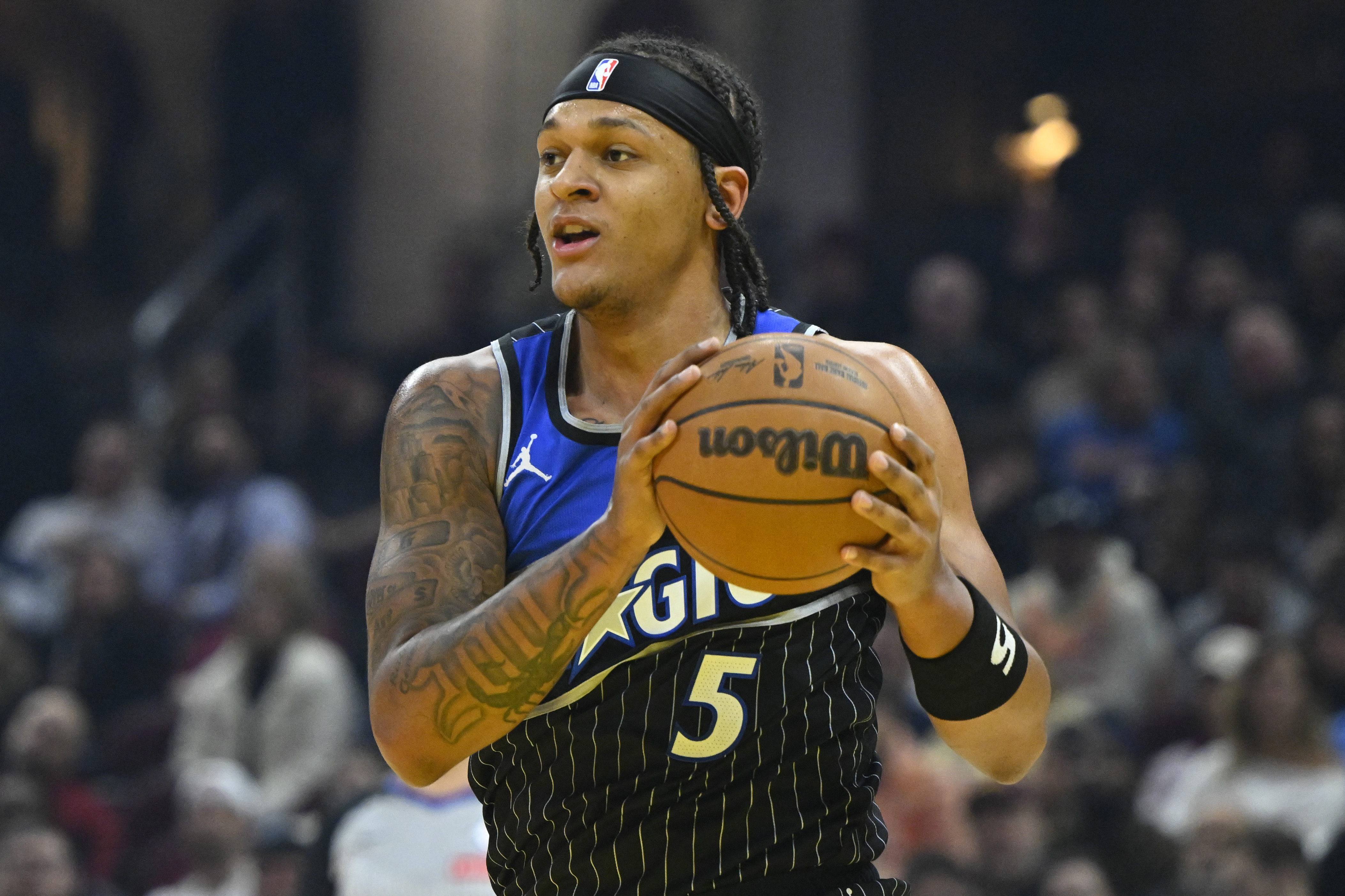 Orlando Magic forward Paolo Banchero (5), seen here rebounding, is featured in our Bucks vs. Magic player props today.