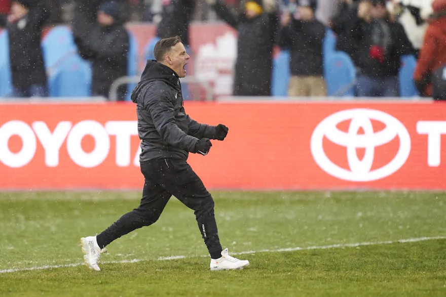 Canada's mens soccer coach John Herdman celebrates after his team defeated Jamaica 4-0 in their World Cup Qualifying match at BMO Field in Toronto, Ontario, March 27, 2022.