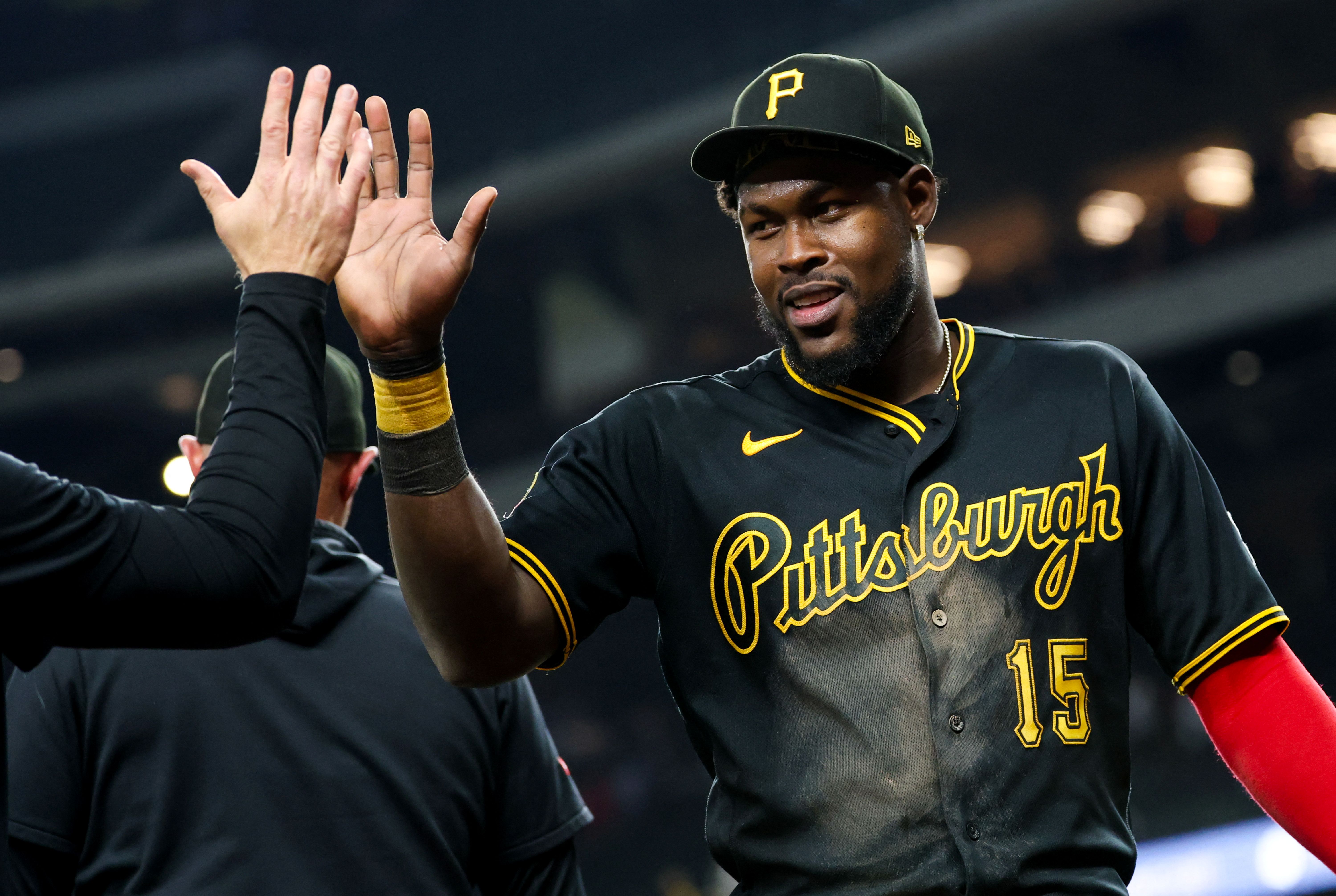 Pittsburgh Pirates center fielder Oneil Cruz celebrates with teammates, and he's key as we look at our Pirates vs. Brewers prediction.