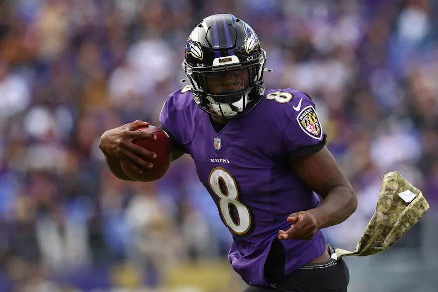 Quarterback Lamar Jackson #8 of the Baltimore Ravens runs with the ball against the Minnesota Vikings in the second quarter at M&T Bank Stadium on Nov. 07, 2021.