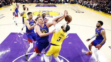 Anthony Davis of the Los Angeles Lakers takes a shot against Nikola Jokic of the Denver Nuggets in the first quarter during Game 3 of the Western Conference playoffs. We're backing Jokic in our Lakers vs. Nuggets player props. 