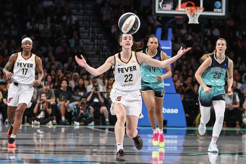 Indiana Fever guard Caitlin Clark (22) reacts as we offer our best Liberty vs. Fever prediction for Saturday's WNBA matchup at Gainbridge Fieldhouse in Indianapolis.
