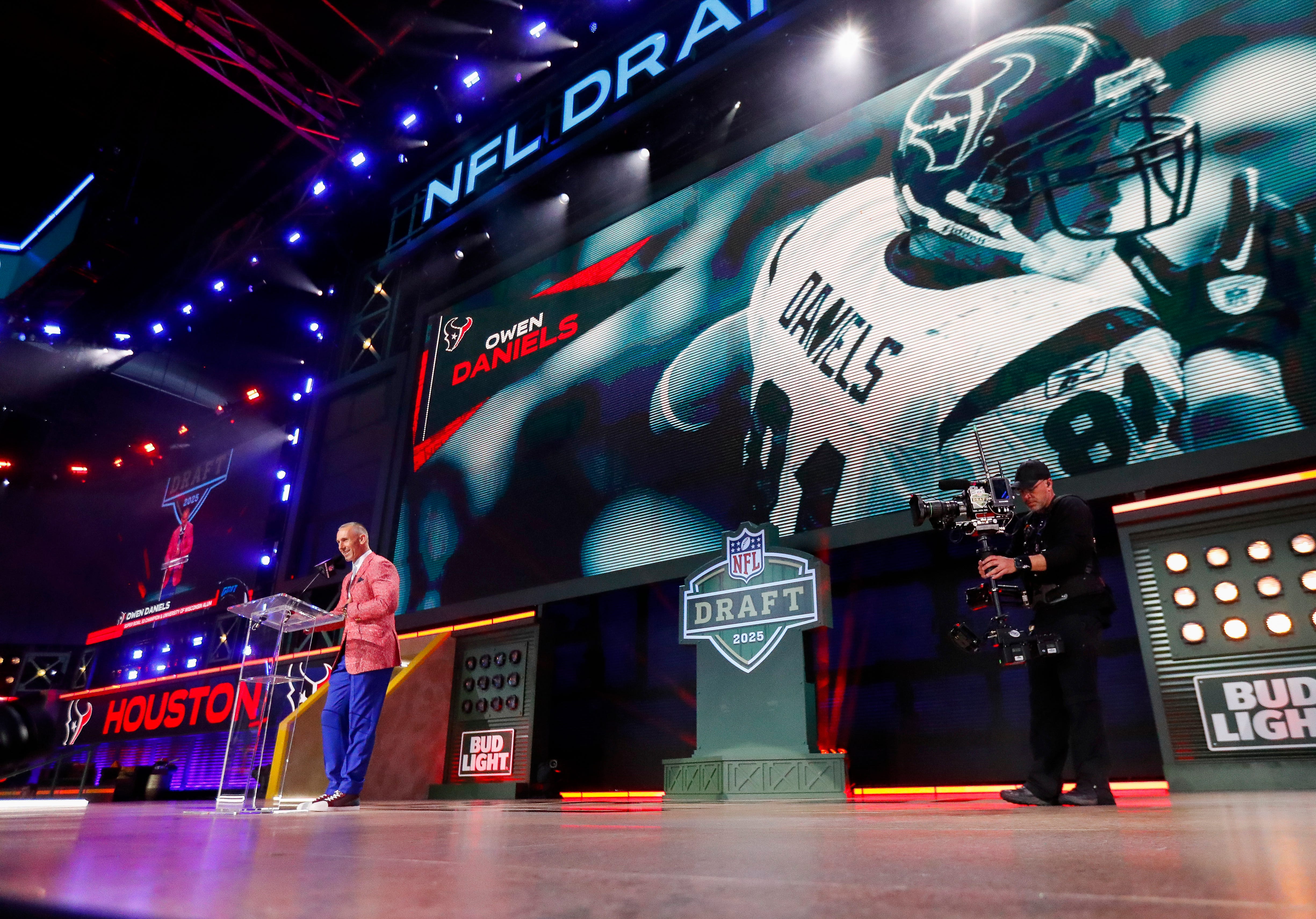 Former Houston Texans tight end Owen Daniels announces the team’s second round pick during the 2025 NFL Draft on Friday, April 25, 2025, at Lambeau Field in Green Bay, Wisconsin.