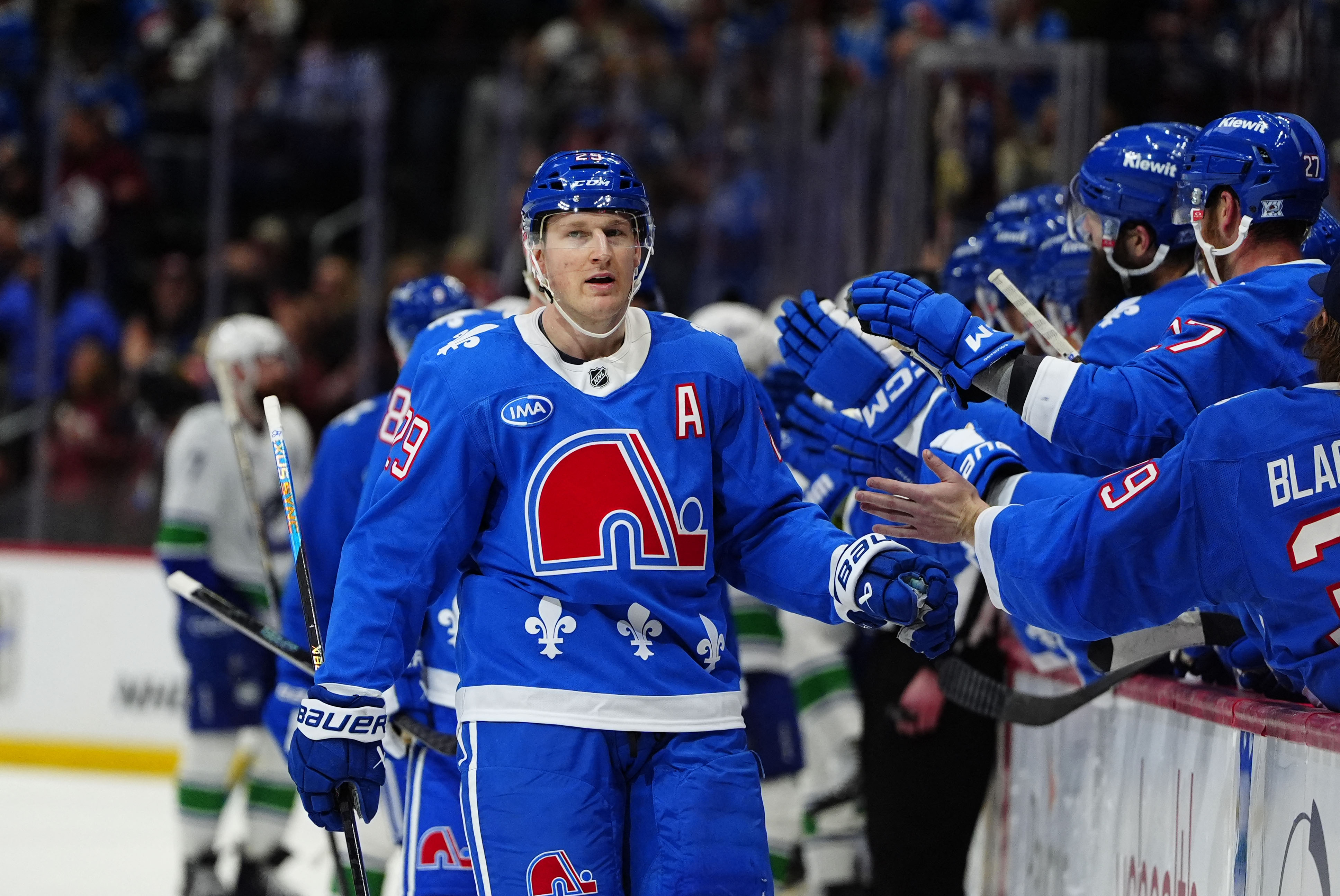 Colorado Avalanche center Nathan MacKinnon (29), seen here celebrating during a game, is featured in our Golden Knights vs. Avalanche prediction for Game 1 today.