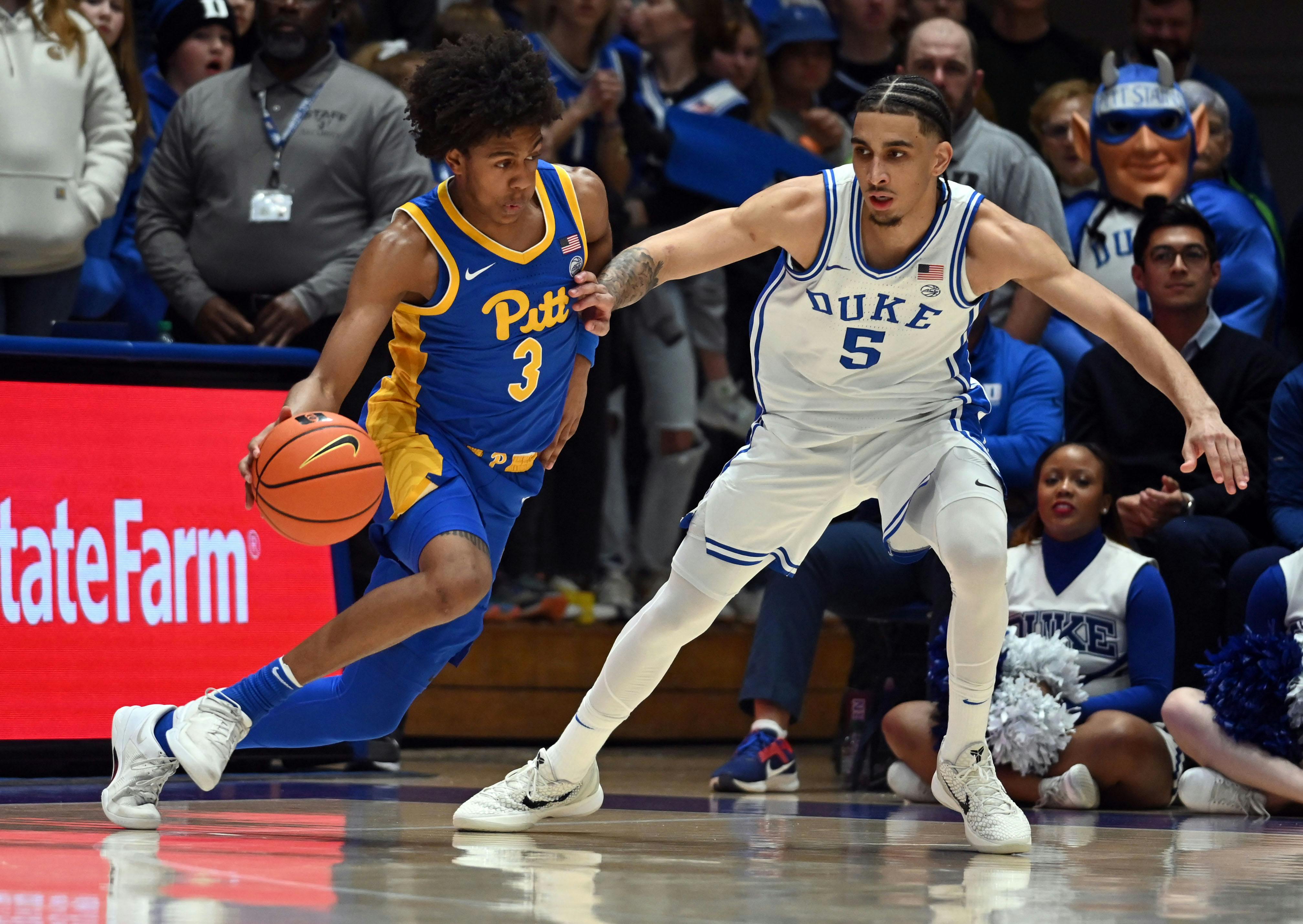 Pittsburgh guard Brandin Cummings drives to the basket as Duke guard Tyrese Proctor defends. Proctor is a big reason why Duke leads the March Madness odds.