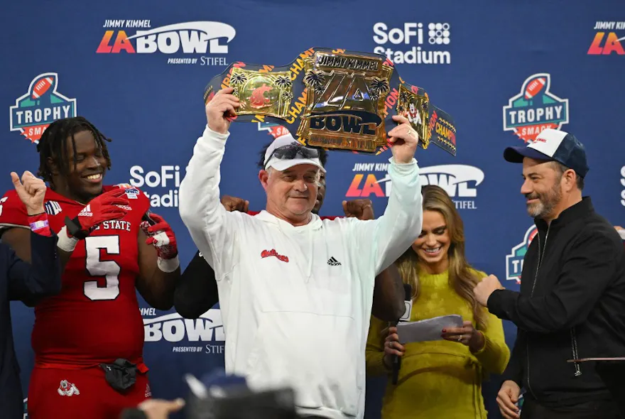 Head coach Jeff Tedford of the Fresno State Bulldogs holds up the championship belt following the LA Bowl as we share our top upset picks for Week 6.