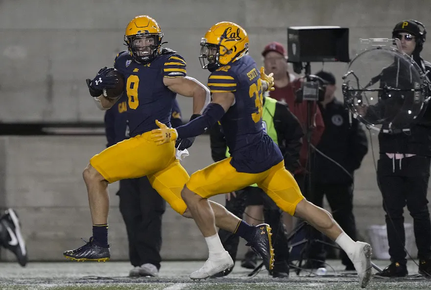 Jackson Sirmon of the California Golden Bears returns a fumble 37 yards for a touchdown against the Stanford Cardinal. 