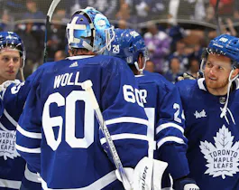 Joseph Woll and William Nylander celebrate a win against the Boston Bruins in Game 6 as we offer our best Toronto Maple Leafs vs. Boston Bruins Game 7 predictions. 