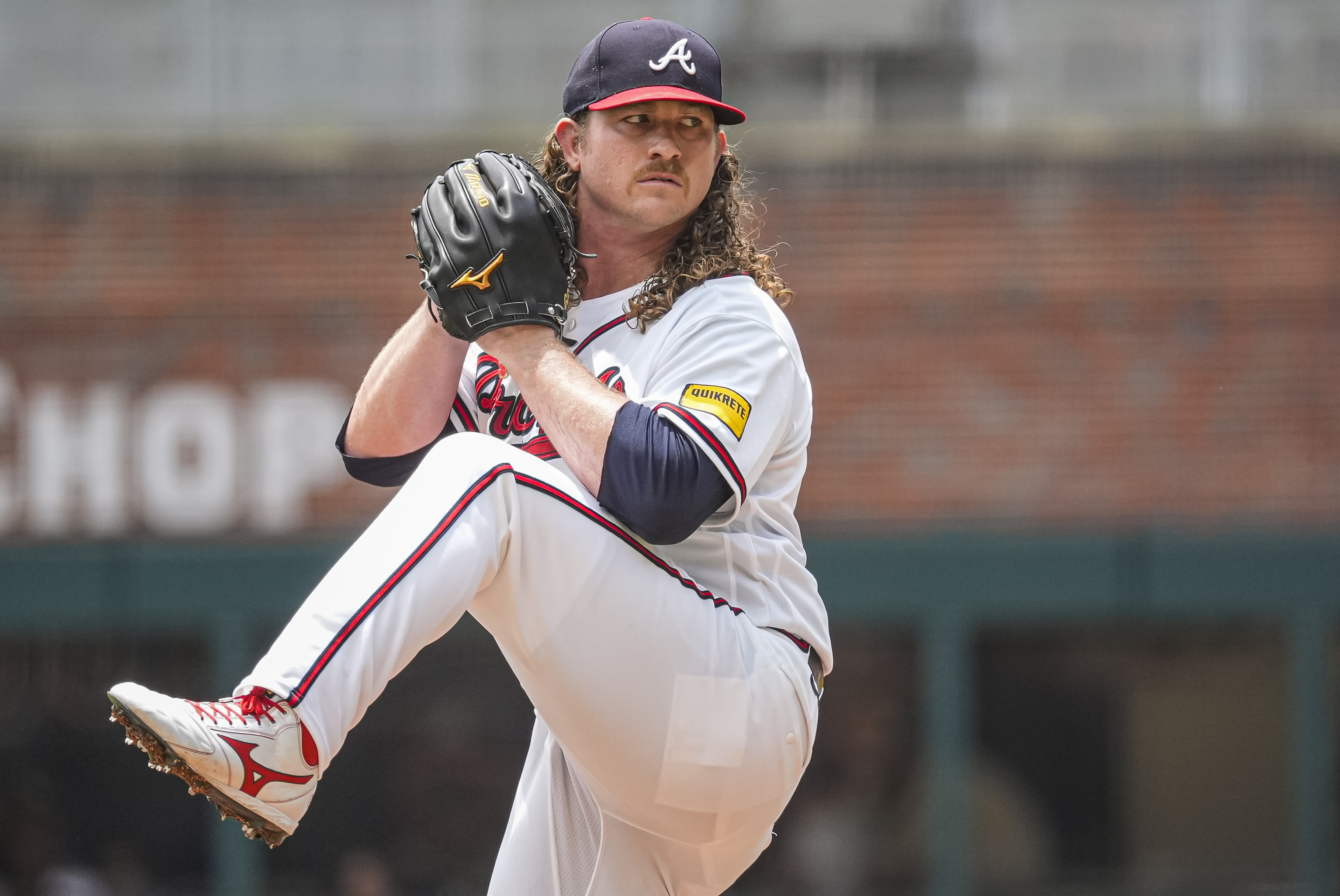 Atlanta Braves pitcher Grant Holmes (66) pitches as he is featured in our best strikeout props today. 