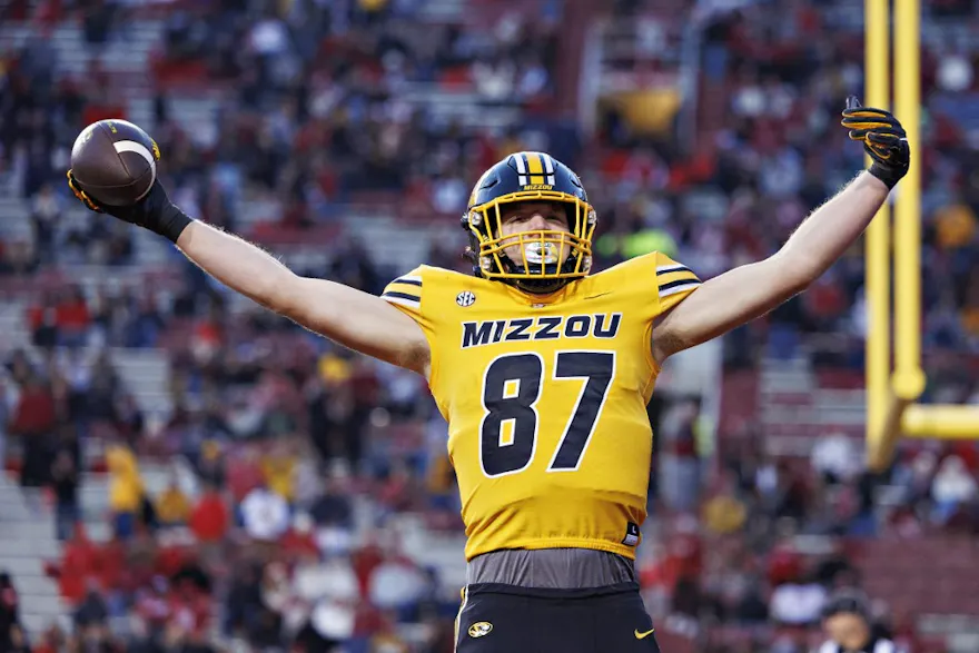 Brett Norfleet of the Missouri Tigers celebrates after running a pass in for a touchdown against the Arkansas Razorbacks, and we offer new U.S. bettors our exclusive bet365 bonus code for Missouri vs. Ohio State.