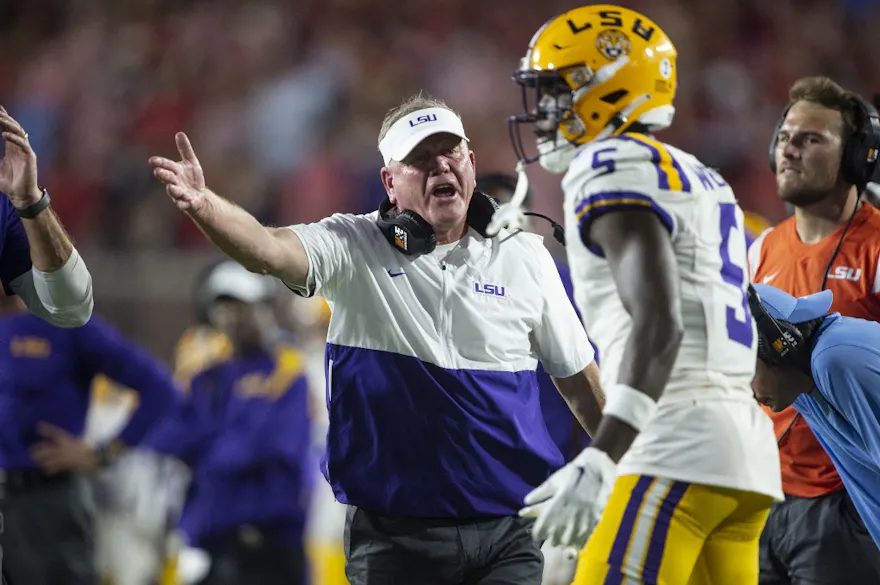 Head coach Brian Kelly of the LSU Tigers talks to quarterback Jayden Daniels of the LSU Tigers during the second half of their game against the Mississippi Rebels as we look at our Week 7 college football parlay picks.