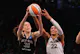 Breanna Stewart (30) of the New York Liberty and A'ja Wilson (22) of the Las Vegas Aces battle in the 2023 WNBA Finals, as we look at the 2024 WNBA MVP odds and predictions with Wilson and Stewart as the betting favorites.