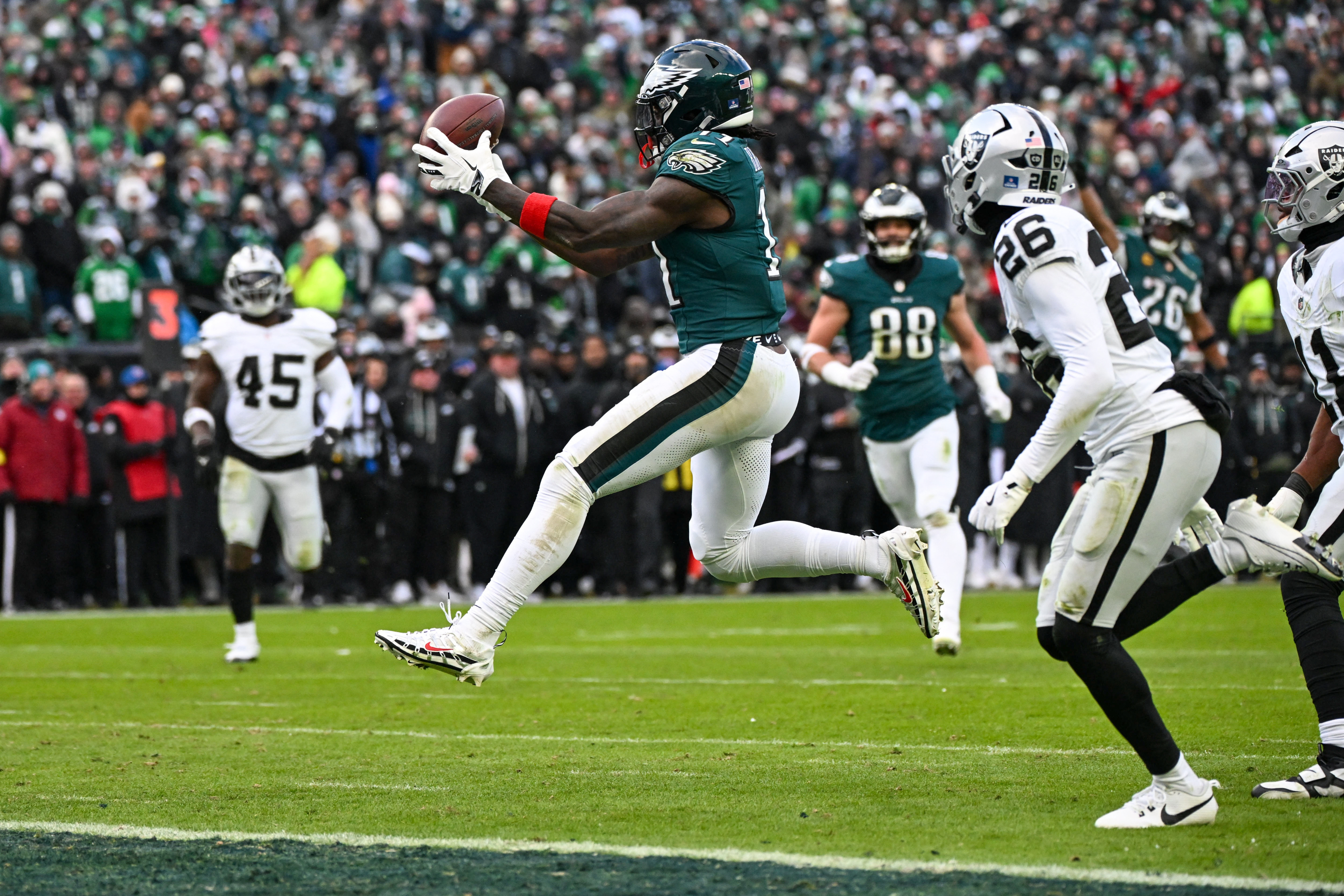 Philadelphia Eagles wide receiver A.J. Brown (11) catches the ball for a touchdown as we look at our anytime touchdown scorer parlay for Wild Card Weekend