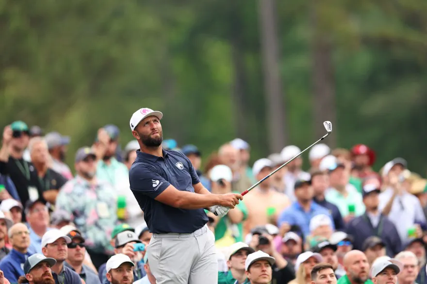 Jon Rahm of Spain plays his shot from the 12th tee during a practice round as we look at Jon Rahm's Masters odds and our top pick