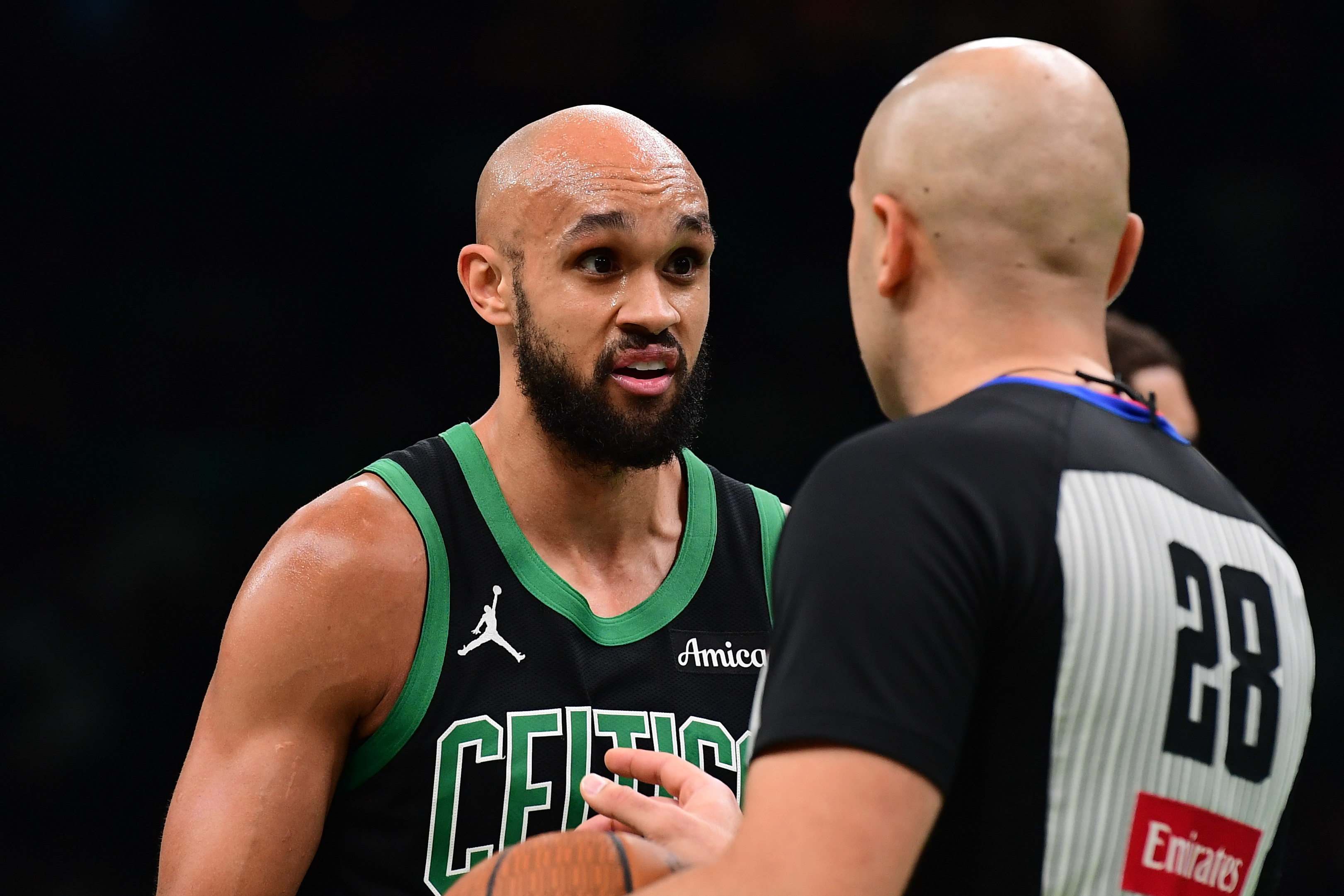 Boston Celtics guard Derrick White (9), seen here speaking with a referee, leads our Pacers vs. Celtics player props.