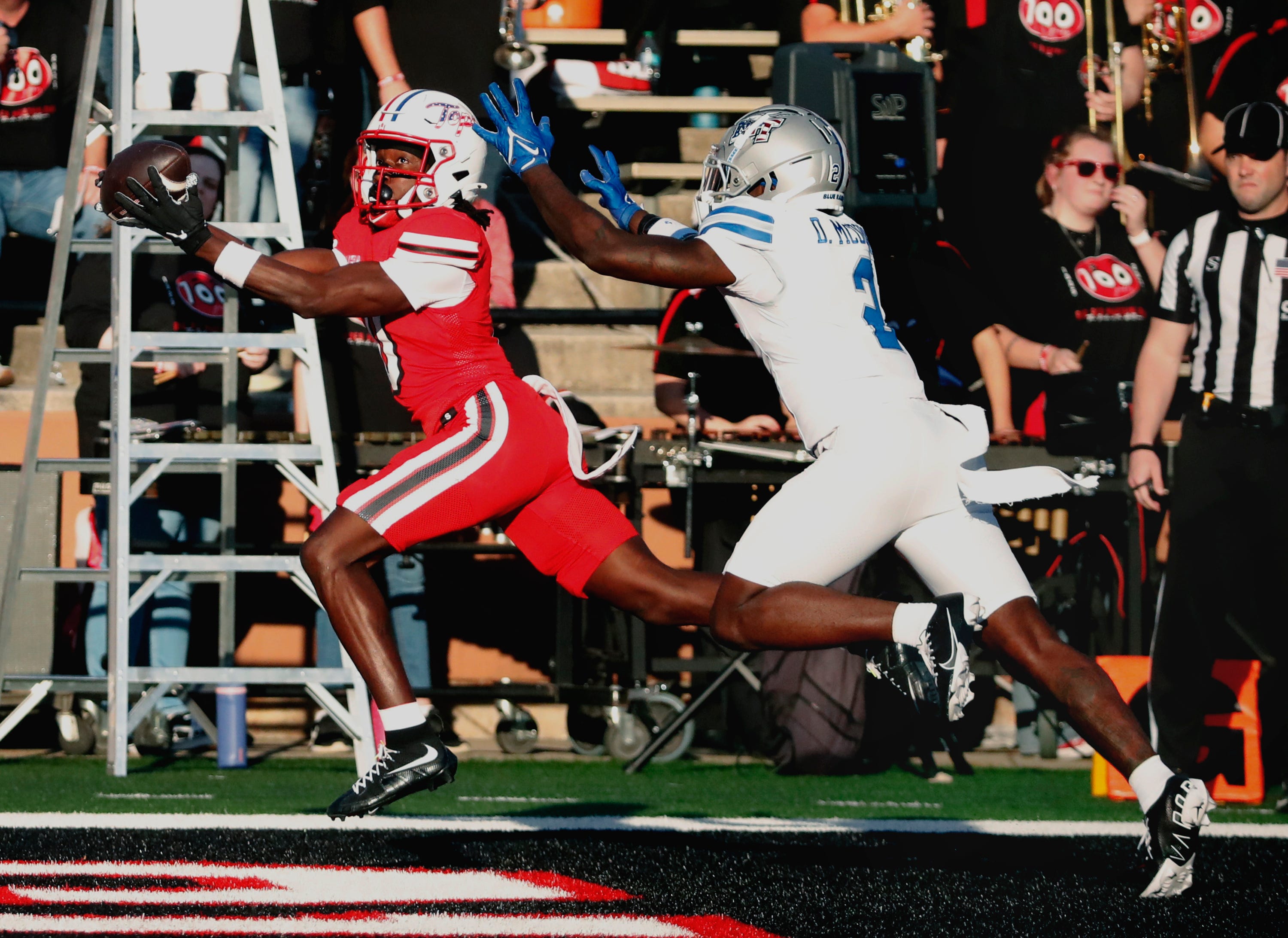 Western Kentucky wide receiver Matthew Henry (0), seen here catching a pass in the end zone for a touchdown, plays a key role in our Western Kentucky vs. Southern Miss predictions.