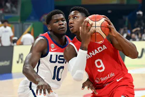 USA’s Anthony Edwards (10) and Canada’s RJ Barrett (9) vie for the ball as we look at the latest Men's Olympic Basketball odds in Paris, France.