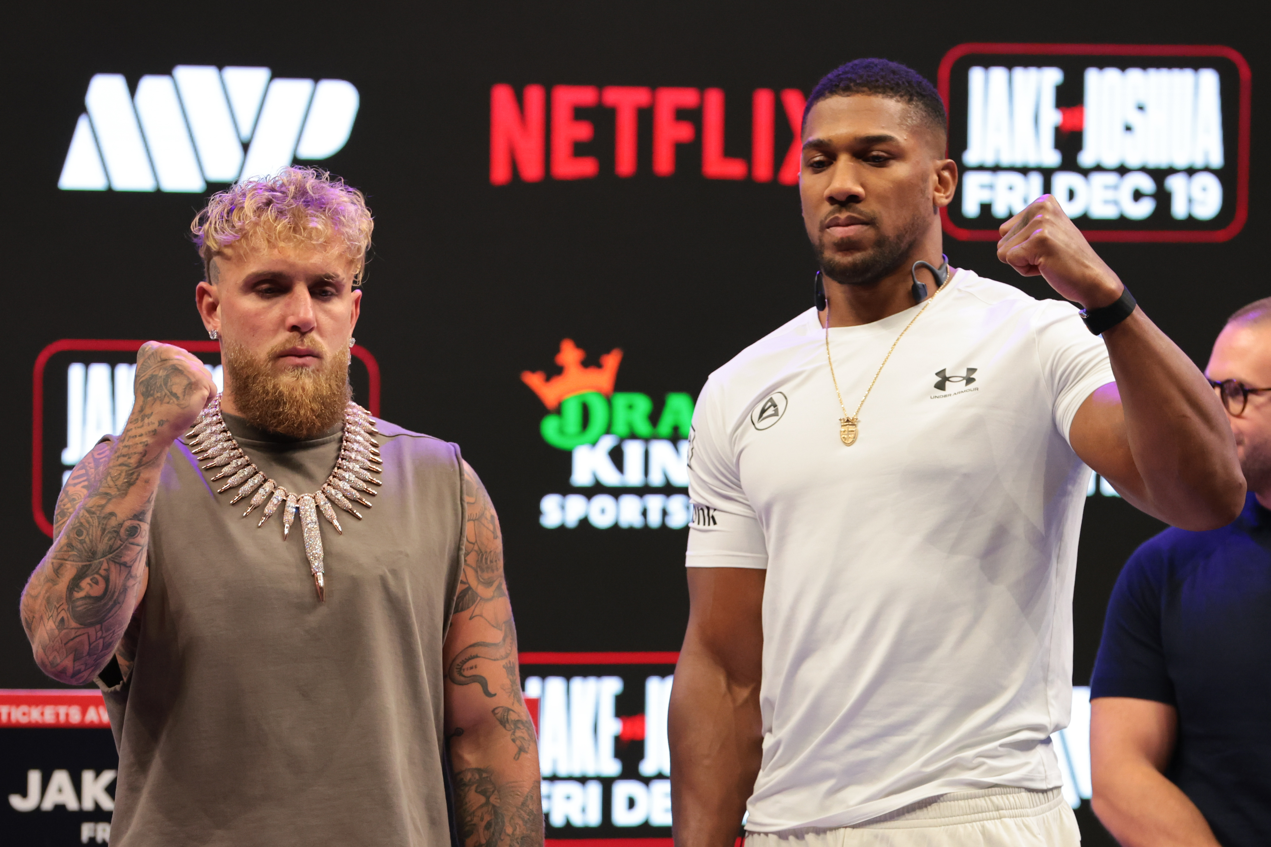 Jake Paul and Anthony Joshua face off after a press conference announcing their heavyweight boxing match at Kayesa Center.