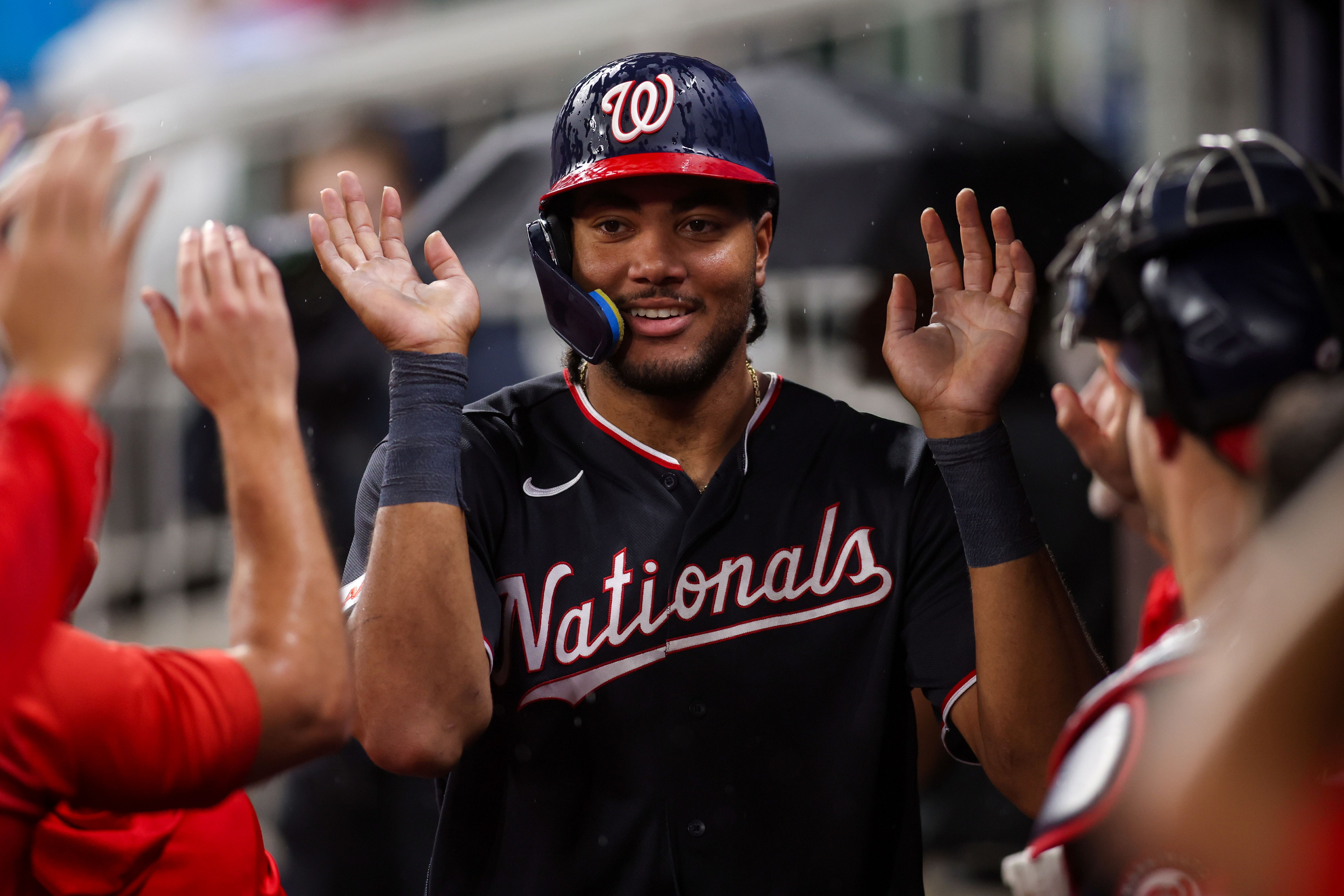 Washington Nationals designated hitter James Wood celebrates with teammates after scoring a run, and he's featured in my Royals vs. Nationals prediction.