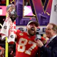 Travis Kelce of the Kansas City Chiefs reacts as he holds the Lombardi Trophy after defeating the San Francisco 49ers during Super Bowl LVIII at Allegiant Stadium as we look at our Chiefs Week 1 opponent odds.